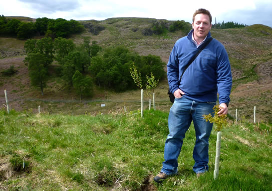 Angus Crabbie, Director of Trees4Scotland, at the newly planted Teaghlach Wood